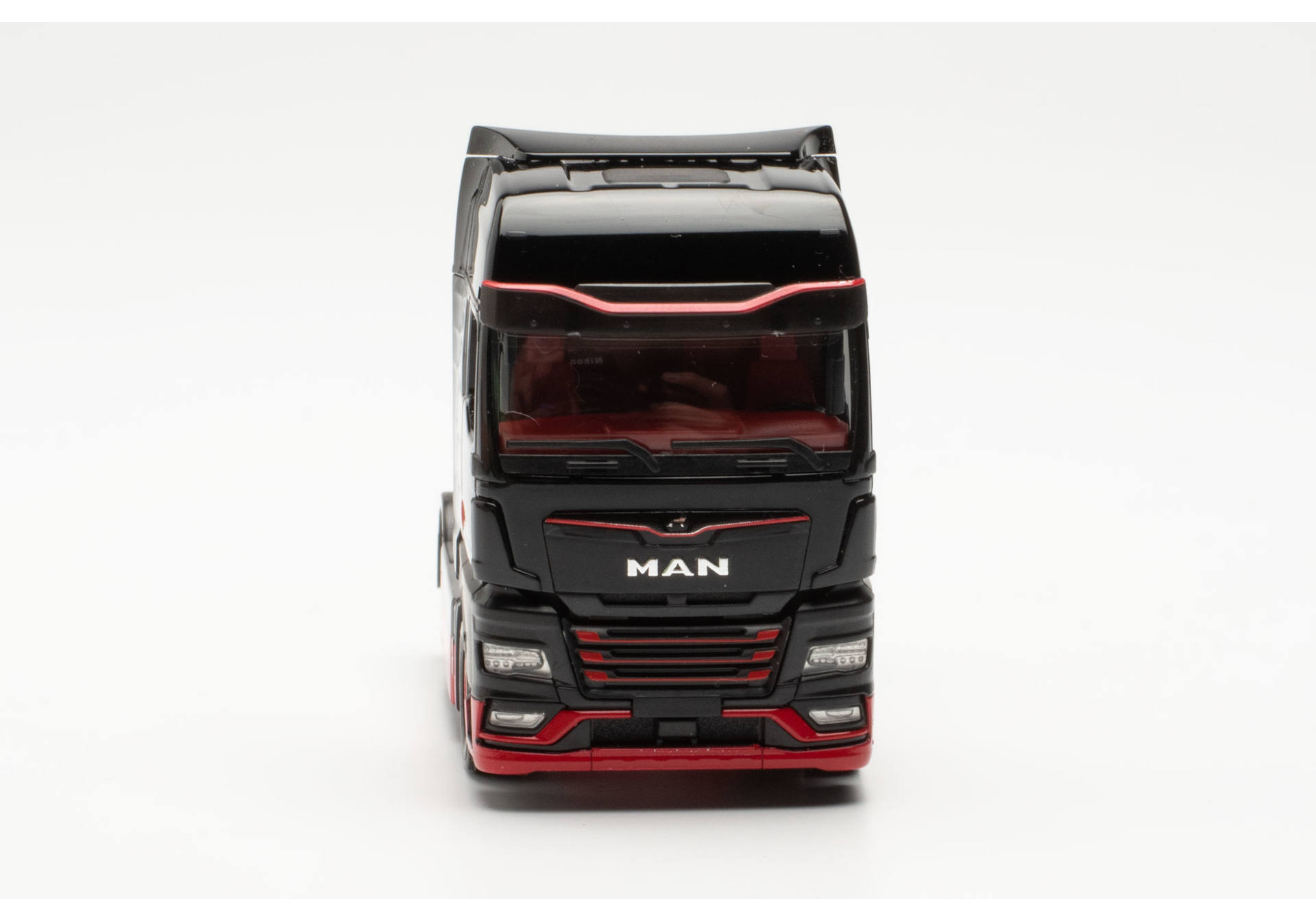 Herpa 317092 | MAN eTGX Zugmaschine | schwarz/rot | 1:87