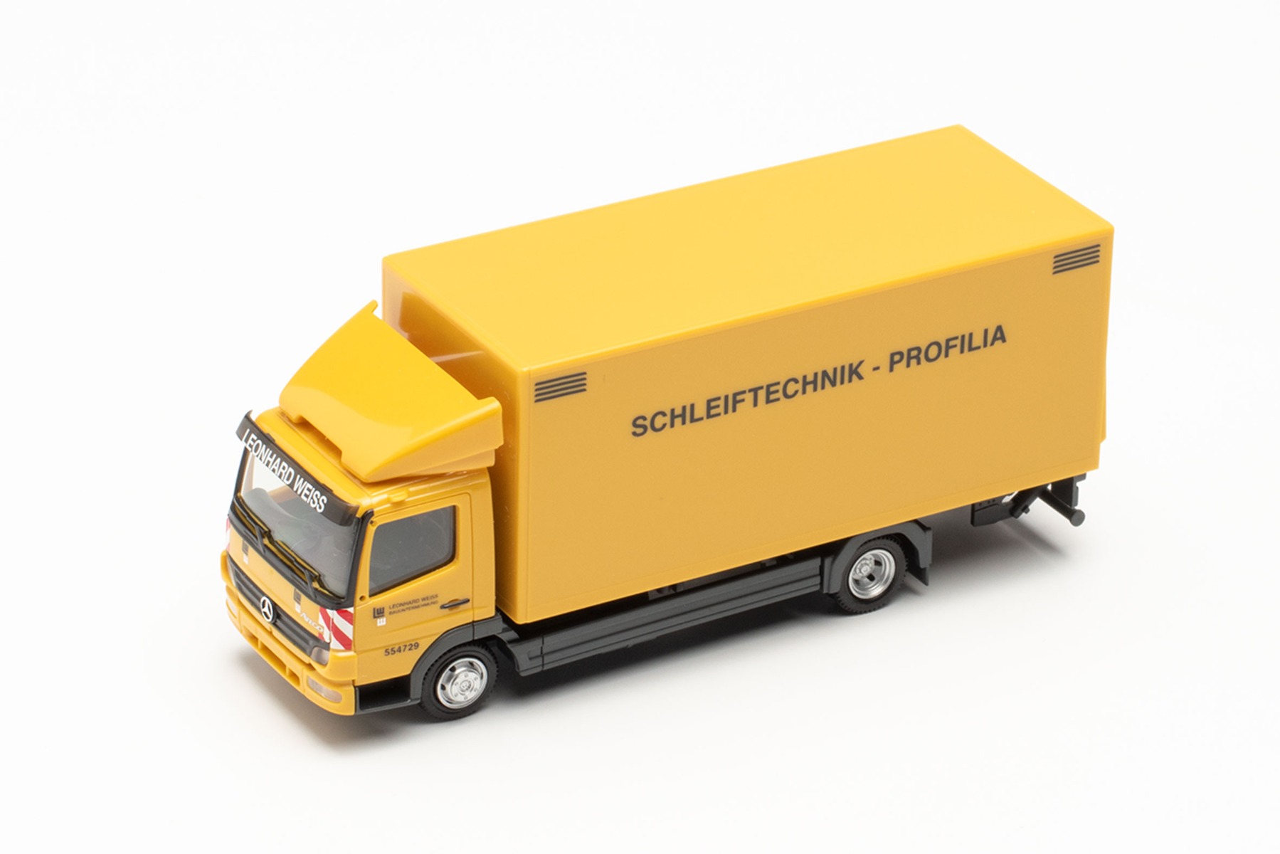 Herpa 950053 - Mercedes-Benz Atego `04 Koffer-LKW mit Ladebordwand "Leonhard Weiss Schleiftechnik Profilia". 1:87