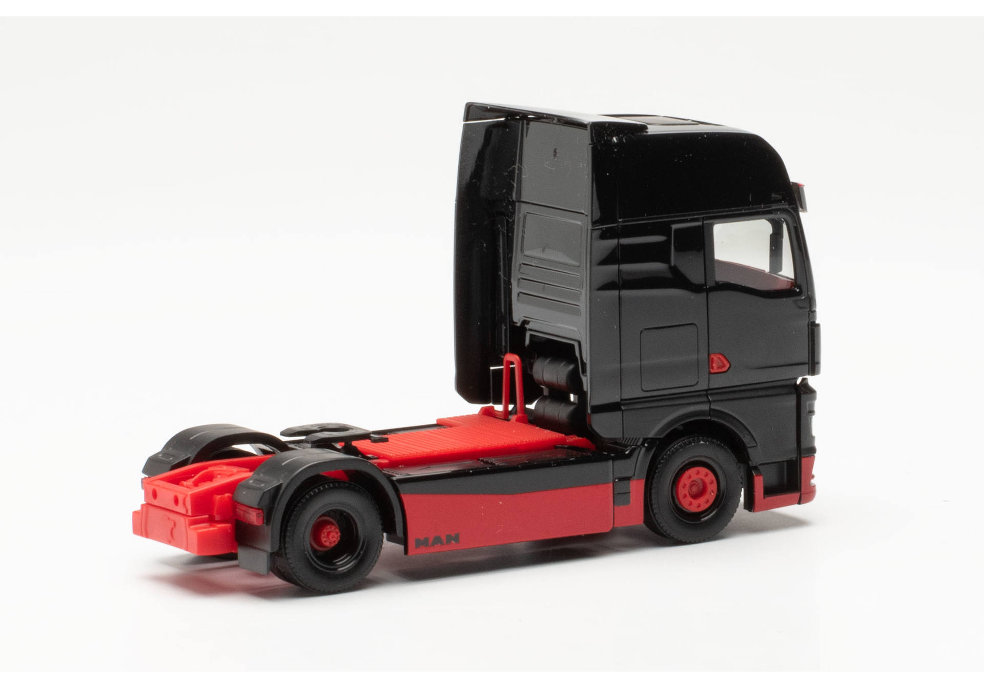 Herpa 317092 | MAN eTGX Zugmaschine | schwarz/rot | 1:87